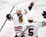 Moore and Murphy help the Blackhawks beat the Blues 7-3 for their 4th straight win