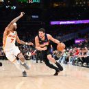 Suns’ Booker out at least week with ankle sprain
