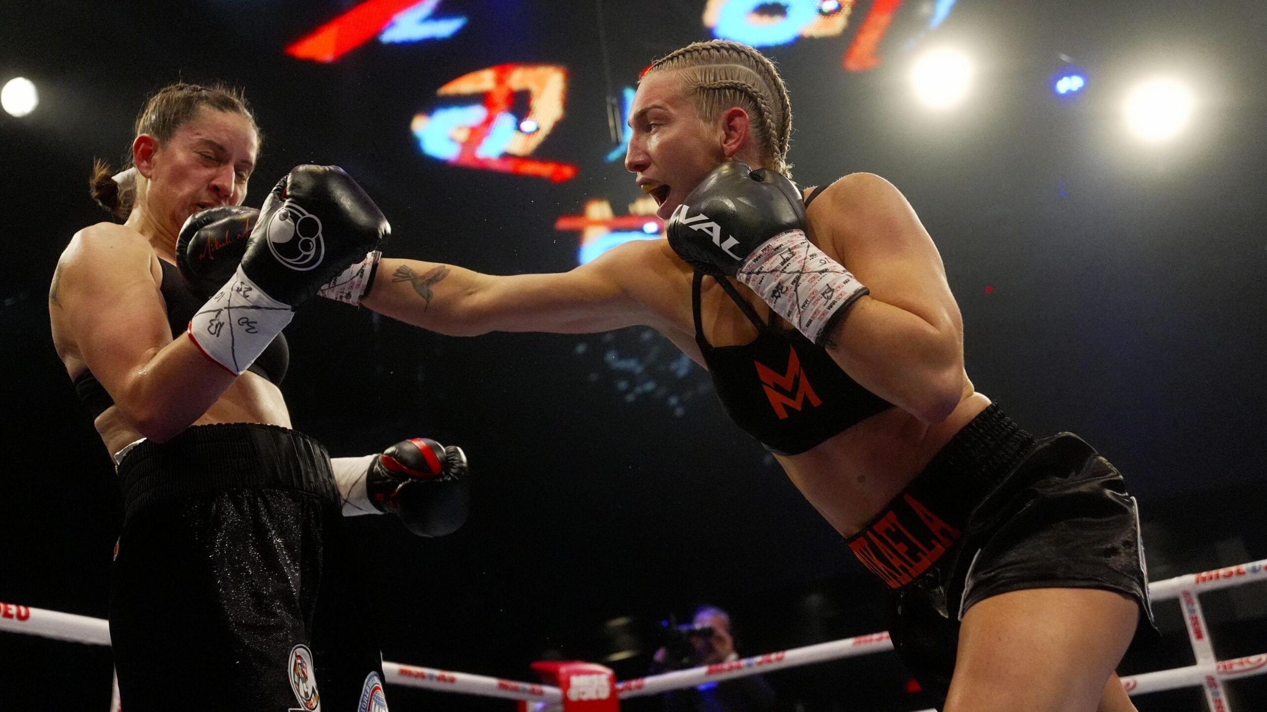 American Mayer becomes three-weight world champion