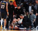 Nuggets' Jokic hobbles off the court following knee injury
