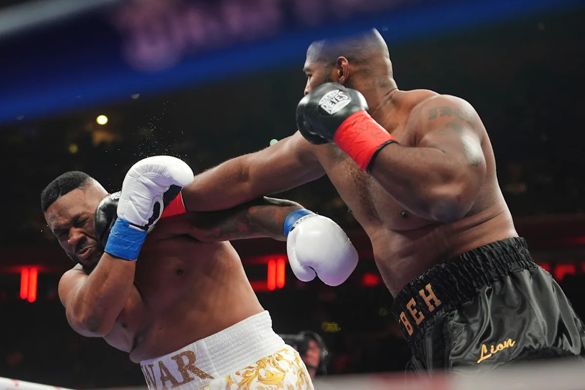 Boxer Jarrell Miller has his hairpiece knocked upward by a punch, then throws it into the crowd